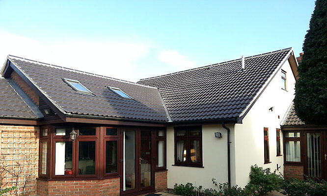 Roofer in Norfolk completing tiled roof repairs