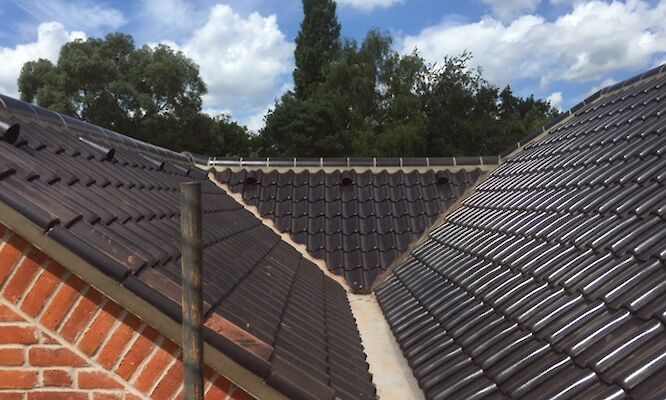 Roofer in Norwich completing tiled roof repairs