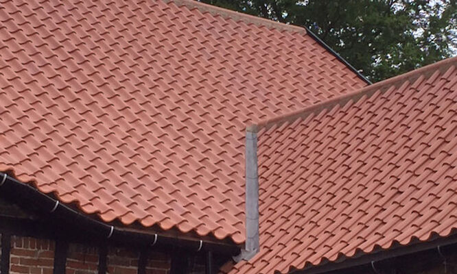 Roofers in Norwich completing tiled roof repairs